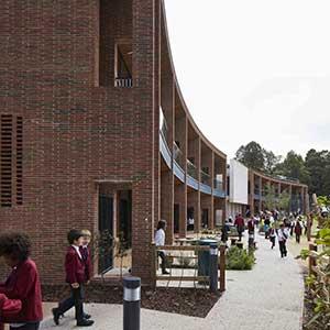 Highgate School -  photo of curving west facade looking over sports fields