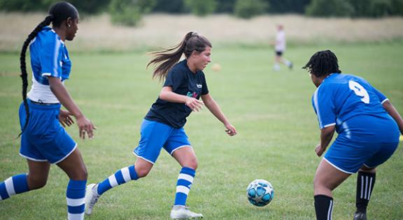 Women playing football.