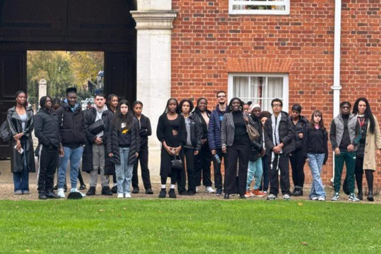 Group of young people standing outdoors at Oxford University 
