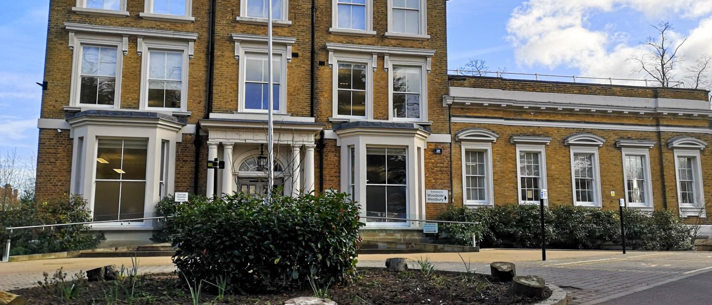 The front exterior of George Meehan House in Haringey, a 3-storey building with rows of windows