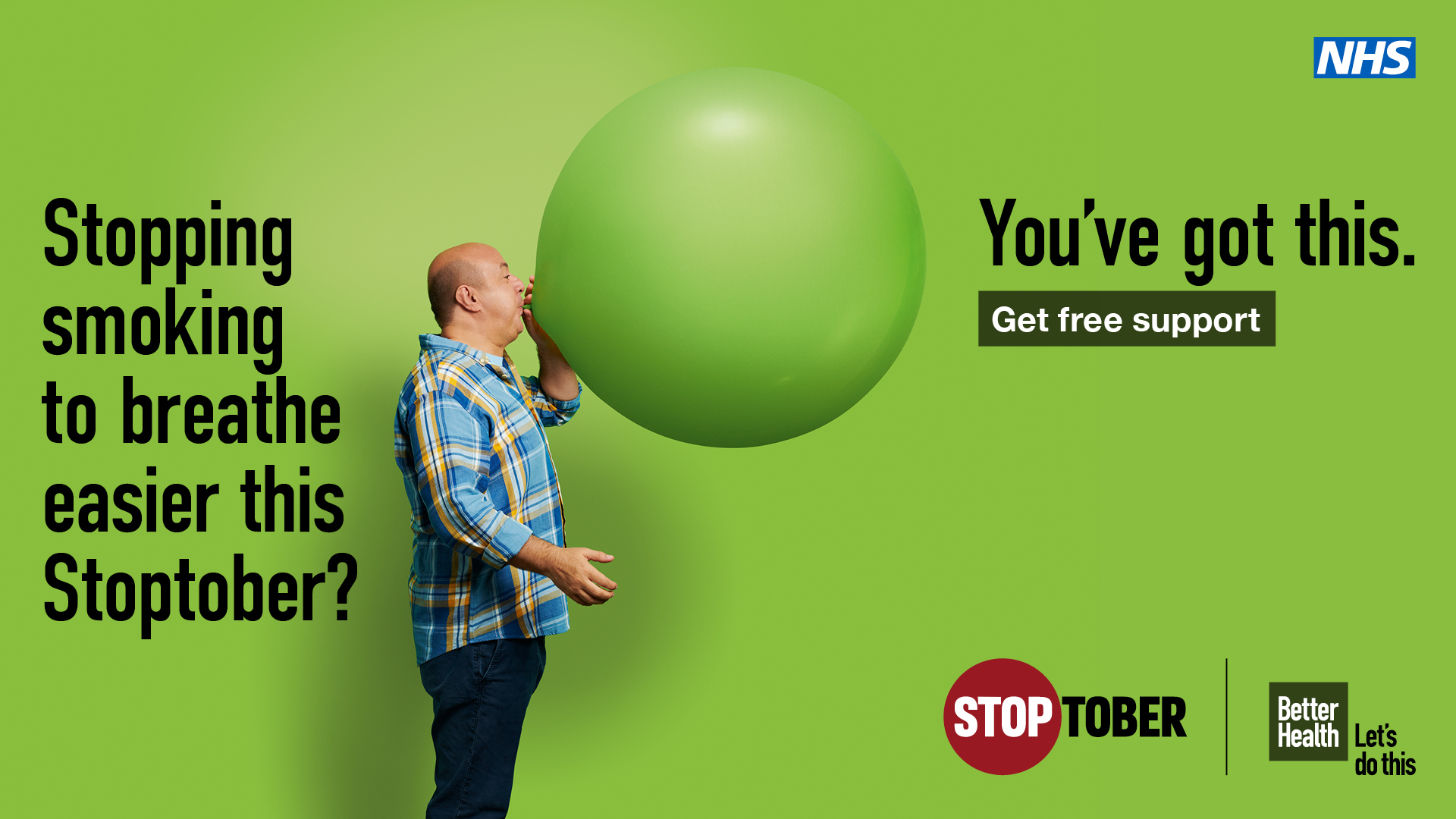 Image of man blowing up a giant balloon.  Stoptober - You've got this!