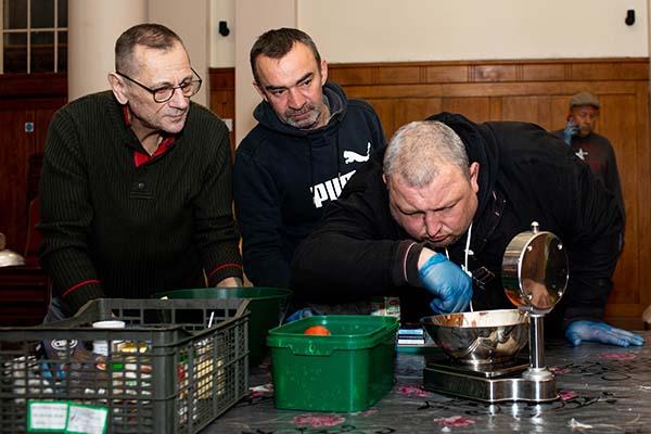 3 men cooking at workshop