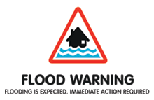 Flood warning sign. Flooding is expected. Immediate action required.