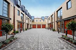 Frederick Mews, with houses either side and commercial over the end