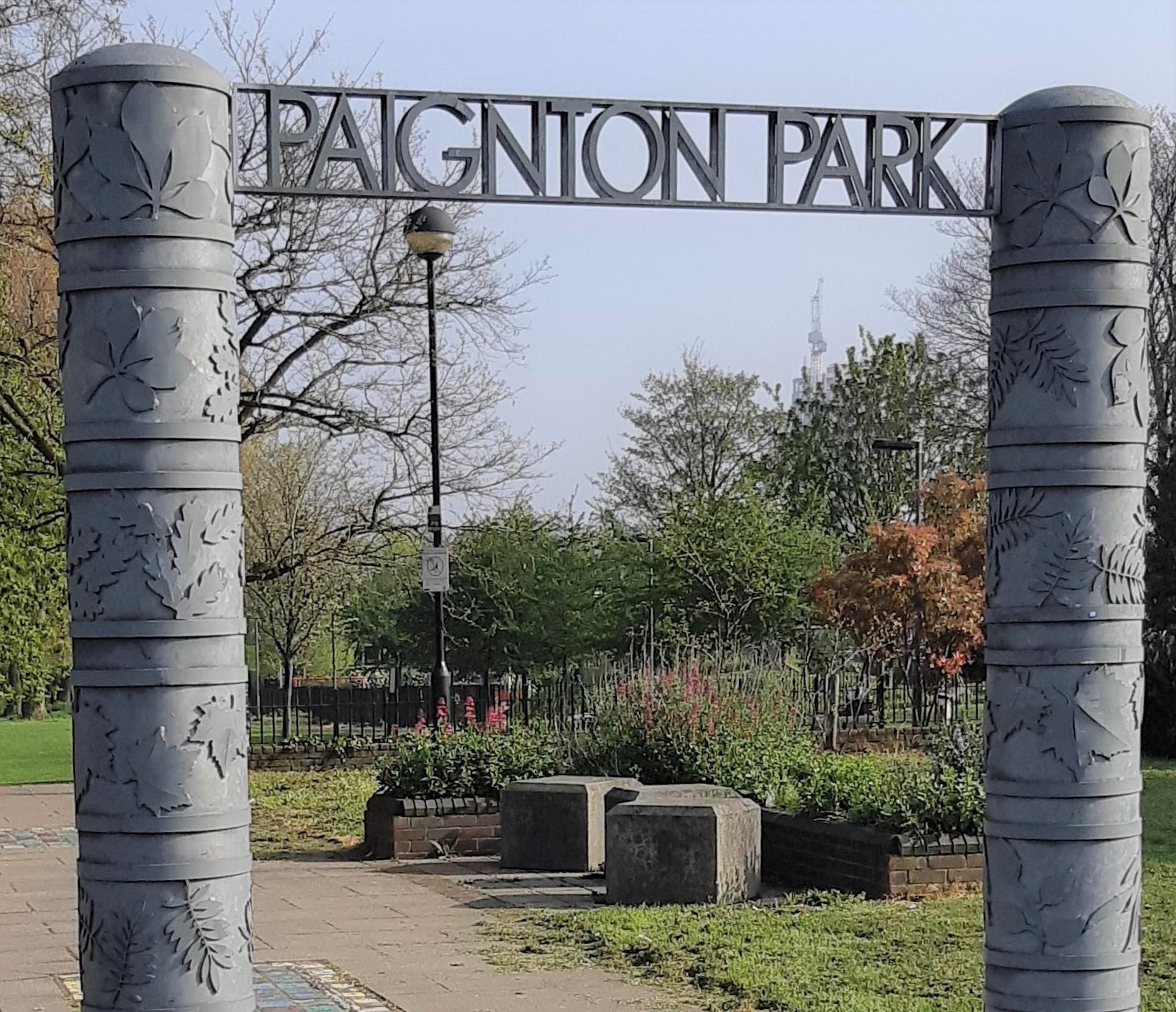 Two pillars with leaf motifs and the words Paignton Park