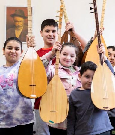 Young students attending a music workshop at the Alevi Cultural  Centre in Wood Green.