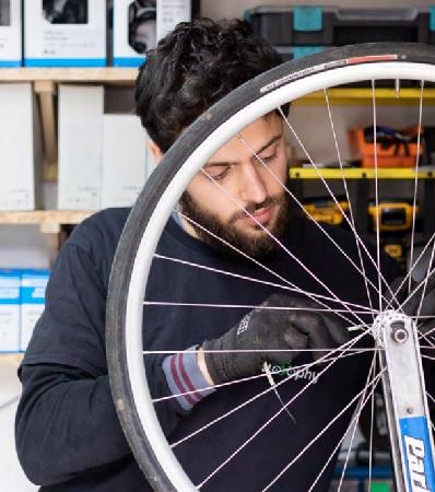 Francesco working in his Fixlosophy bike shop and workshop in  Blue House Yard.